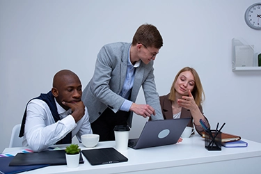 Image of three people doing analysis